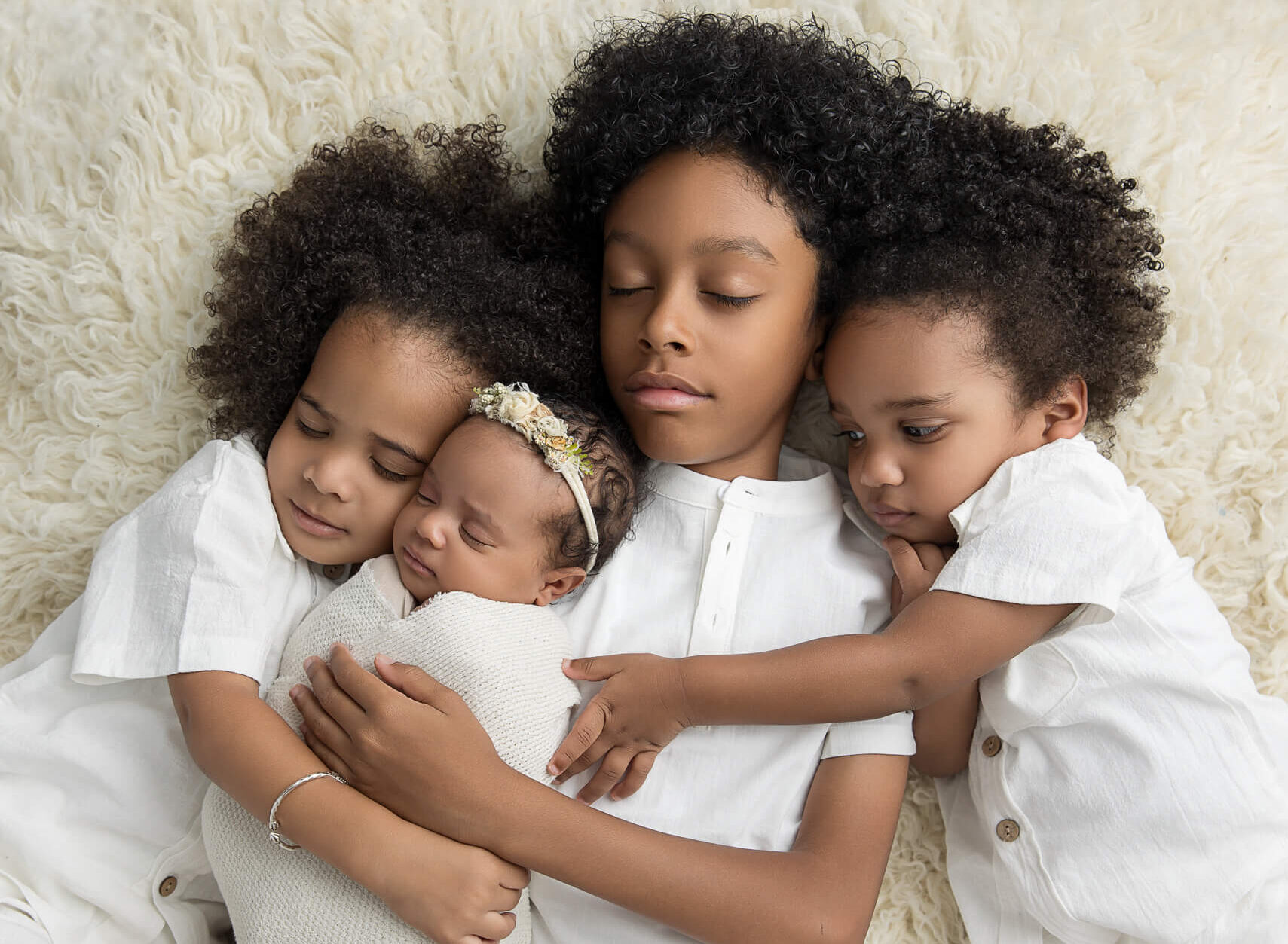 newborn girl with three brothers