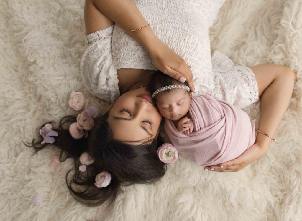 mom holding newborn captured by atlanta newborn photographer