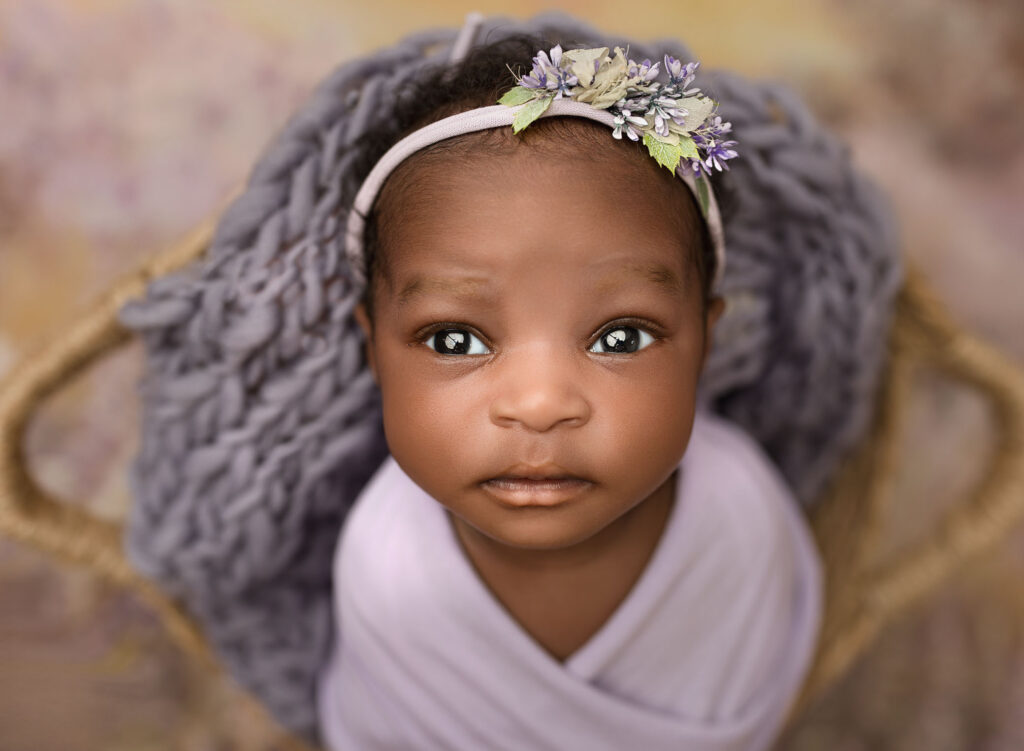 beautiful babies with eyes wide open photographed at Sandy Springs, GA newborn photographer studio