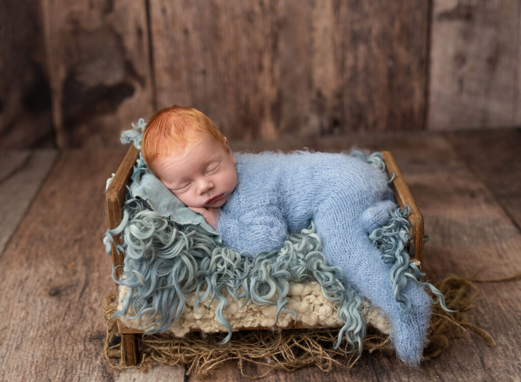 Baby resting with white noise machine nearby during newborn session in Sandy Springs, GA